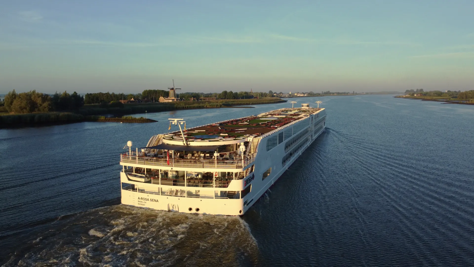 Eco-friendly river cruise ship A-ROSA SENA with waste heat recovery system and hybrid propulsion on European inland waterways.