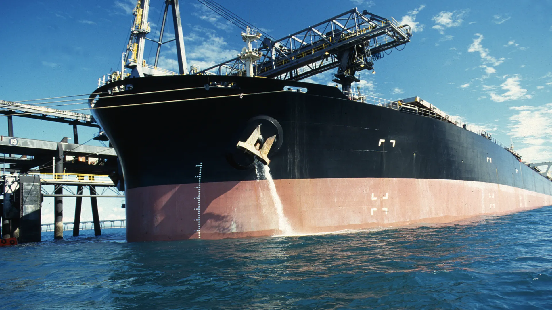 Ship discharges treated ballast water using an alternative environmentally friendly ballast water treatment technique.