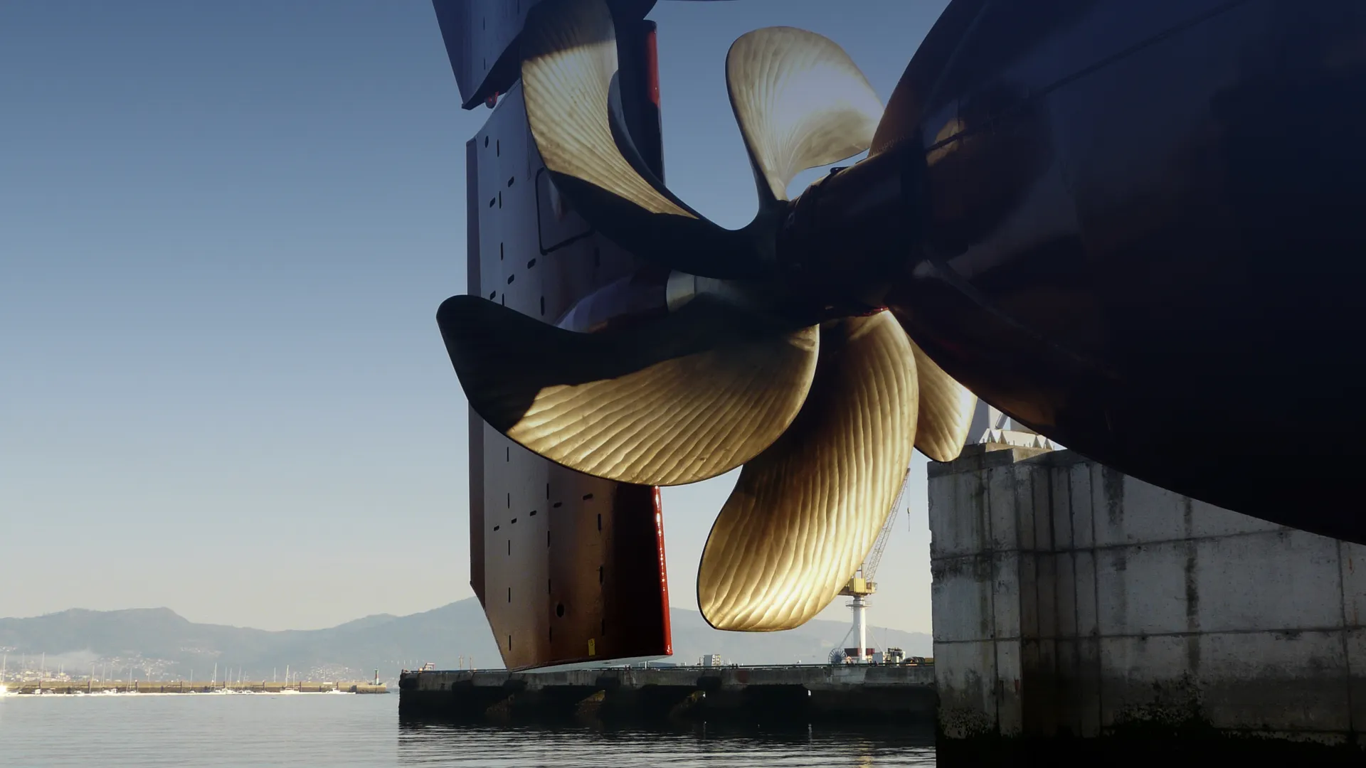 This image shows a CFD-optimized ship propeller beneath the hull of a ship.